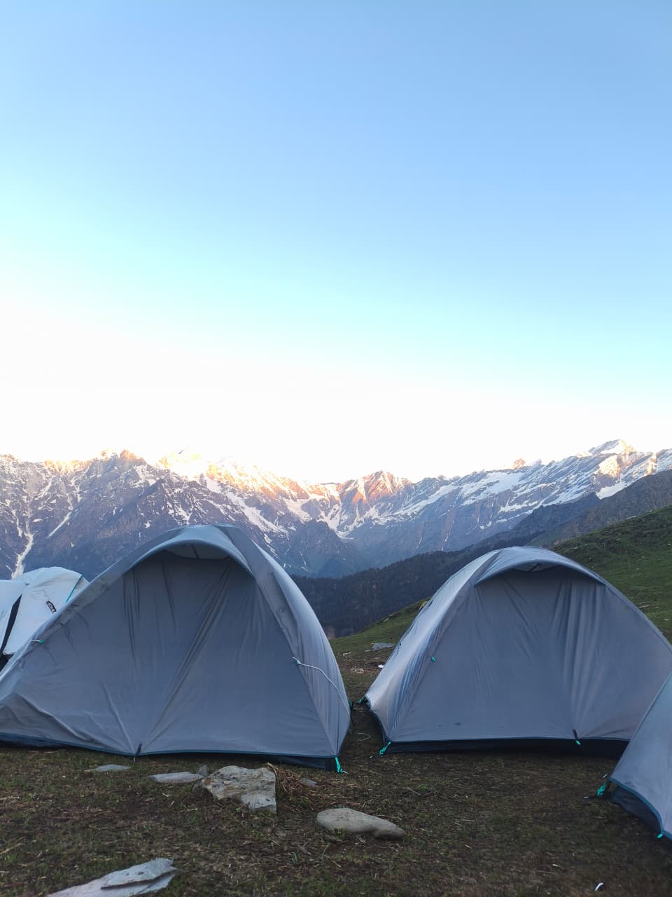 Expedition team navigating through high altitude alpine valley