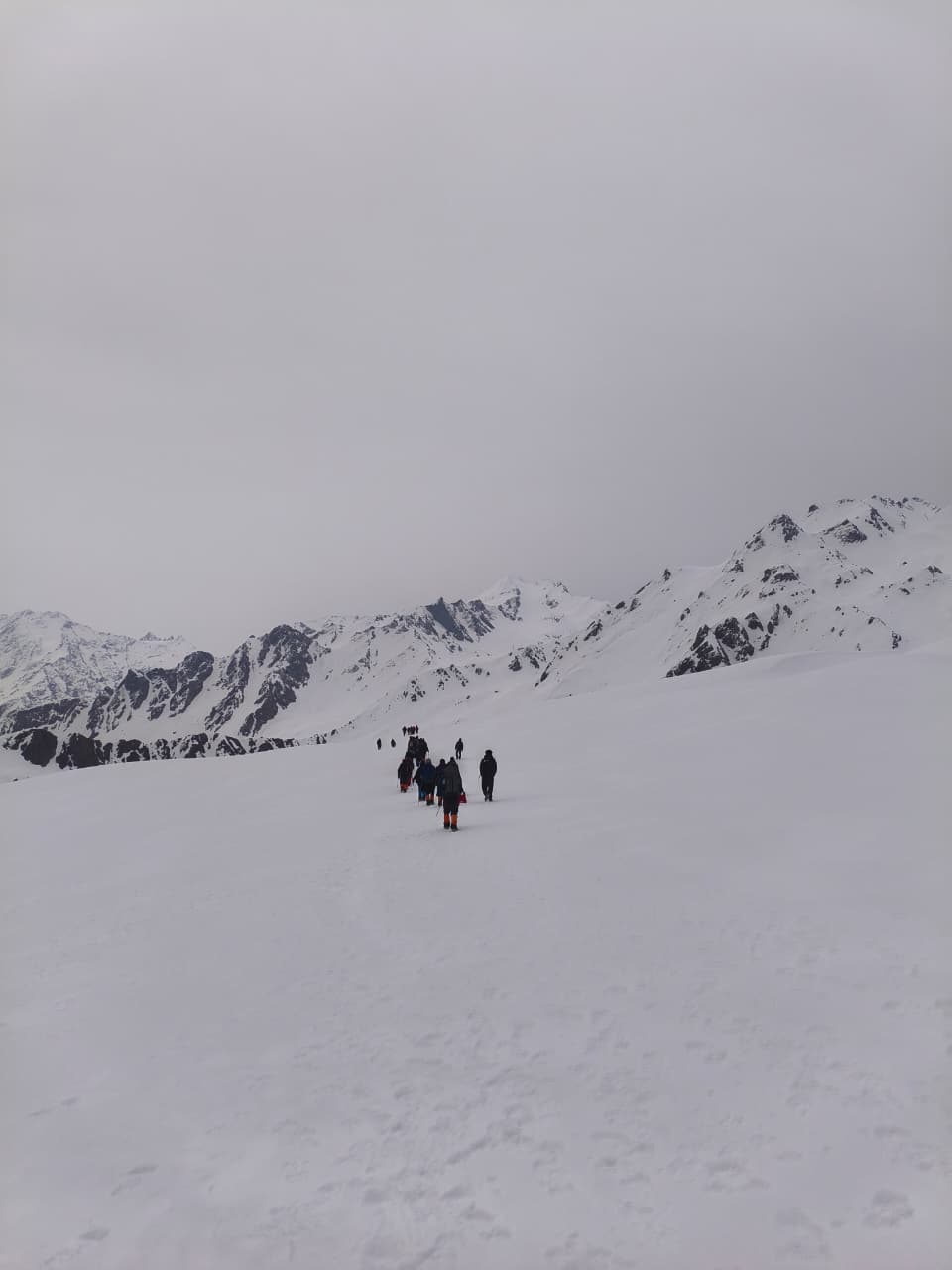 Trekker reaching the Himalayan summit at dawn